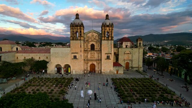 fixed drone shot of santo domingo temple world heritage site in oaxaca city mexico and air ballons