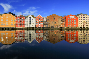 Fototapeta na wymiar Autumn in Trondheim, view of the river Nidelva and historical timber buildings