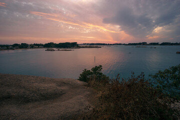 Bay of Ploumanac'h during sunset on a summer evening with islands, Cote de Granit Rose Brittany , France