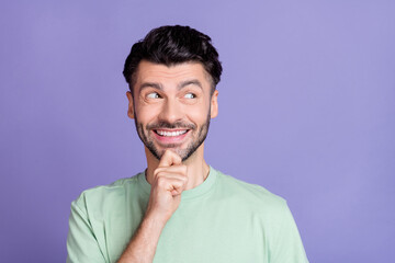 Close up photo of positive man dressed trendy clothes interested look empty space news cool offer isolated on purple color background