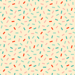 Retro confetti sprinkles seamless pattern. Pastel party seamless pattern in pastel pink, blue and red on cream background.