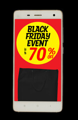 Word text black friday event up to 70% off written on yellow circle with black paper bag inside white smartphone isolated on black background. banner. copy space