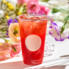 cold summer lemonade with strawberries and ice in plastic glass to take awa - obrazy, fototapety, plakaty