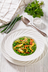 petits pois, french dish of garden green peas