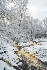 Flowing water in a river on a cold winter day