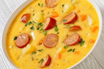 German potato soup with sausages in bowl