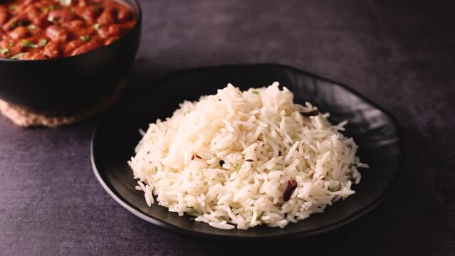 Kidney bean curry or rajma or rajmah chawal and rice roti, typical north Indian food main course. Basmati rice with dal curry.  4k video footage