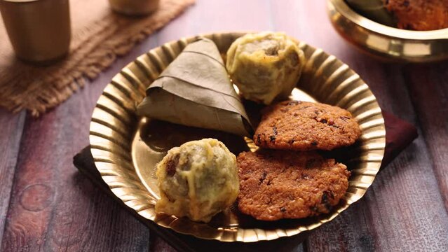 Sukhiyan or Sugiyan Parippu Vada Ila Ada Sweet rice dumplings Elayada steamed rice cakes wrapped in banana leaves famous breakfast or tea snacks of Kerala India.
