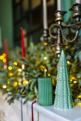 Fireplace decorated for the Christmas holiday. Decorative elements that create the mood at a festive party