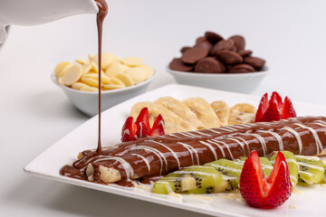 chocolate cake with strawberries and cream