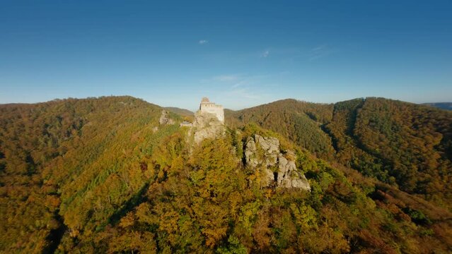 Slow ascending FPV roundshot of Aggstein in warm, autumn light, Wachau, Austria.