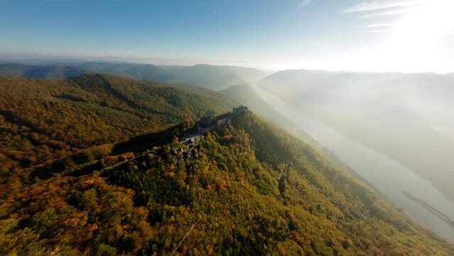 Slow descending FPV shot over stunning Wachau hills and Danube valley toward Aggstein, Wachau, Austria.