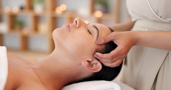 Wellness, spa and woman getting facial massage in beauty salon to relax. Calm, peace and luxury treatment for skin, massage therapy for stress relief, skincare and beautician massaging face of client