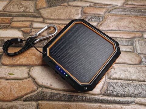 photo charging process Power Bank sollar cell or panel from direct morning sun shine