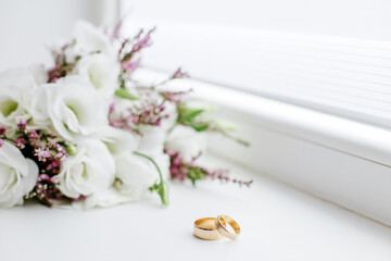 Wedding bouquet and rings. Marriage and love concept. Copy space