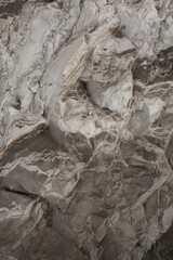 Horizontal closeup view photography of details of texture of real moutain in cut. Abstract organic photo background.