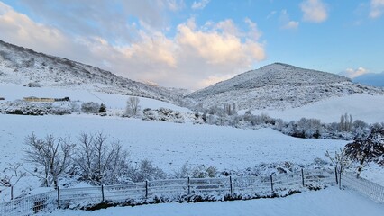 Fototapeta na wymiar Winter landscape with a view of a snowy mountain