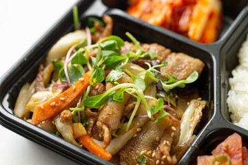 Various side dishes and samgyeopsal lunch box