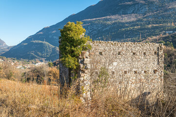 Fototapeta premium Ruins of an ancient medieval settlement along the Roggia di Calavino nature trail - Trento province, Trentino Alto Aduge- northern Italy