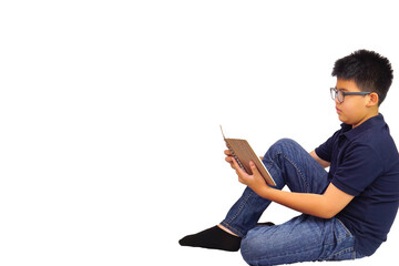 Young boy sitting happily read a book. Education and learning concept.