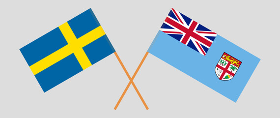 Crossed flags of Sweden and Fiji. Official colors. Correct proportion