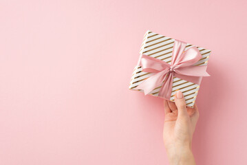Christmas Eve celebration concept. First person top view photo of woman's hand holding stylish...