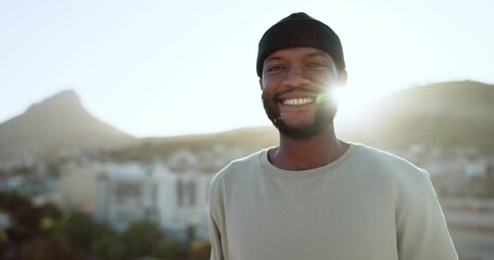 Face, happy and street style with a black man outdoor in the city with nature in the background during summer. Portrait, fashion and urban with a handsome young male standing outside in a bright town - Powered by Adobe