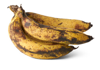 bunch of over ripe black or brown spotted banana, bruises on fruit isolated