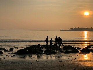 Fototapeta premium Sunset At the Beach Rocks