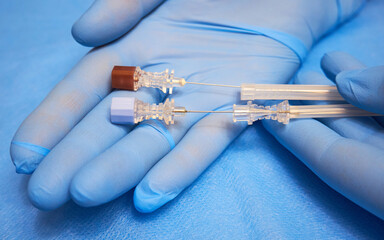 Equipment for regional anesthesia. Injection needles for anesthesia in the hands of a doctor - obrazy, fototapety, plakaty