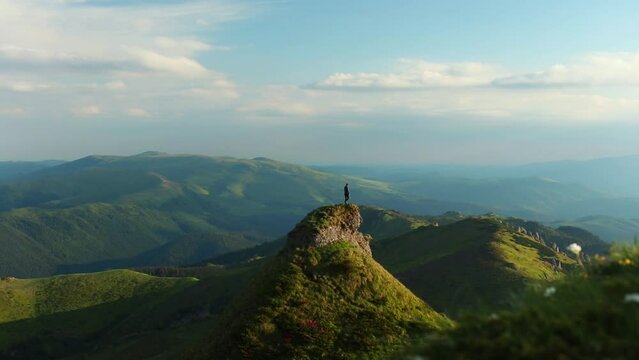 Scenic shot of the green Ciucas mountains against the blue sky in Romania