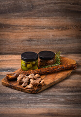 A plateau with appetizers of meat and cheese delicacies, olives, pates.
