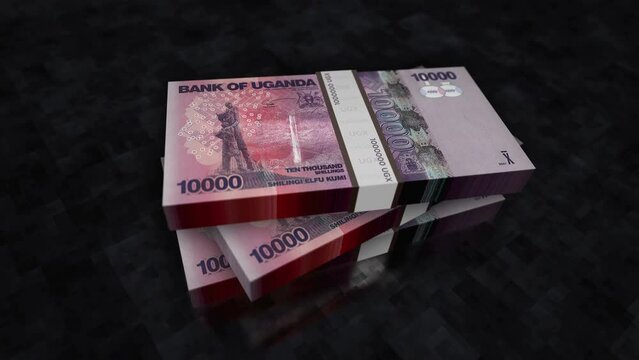 Uganda money Shilling money pile pack. Concept background of economy, banking, business, crisis, recession, debt and finance. 10000 UGX banknotes stacks 3d animation.