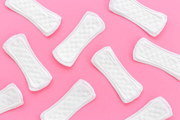Female hygiene concept. White panty liners pattern, top view