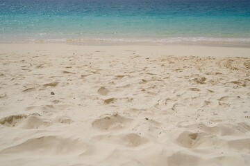 Fototapeta na wymiar The beautiful white sands and clear sparkling sea of Yonaha Beach