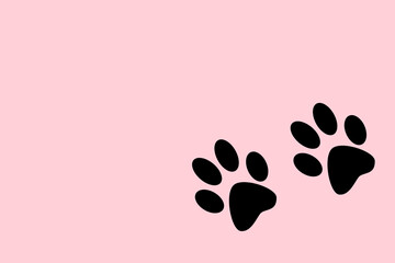 Huellas de pata de gato o perro sobre un fondo rosa pastel liso y aislado. Vista superior y de cerca. Copy space