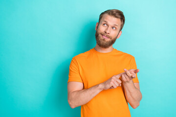 Photo of minded clever young man arms fingers count look empty space isolated on emerald color...