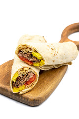 Turkish meat doner wrap isolated on white background. Traditional flavors. Doner kebab made from...