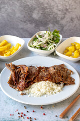 Meat doner with rice on gray background. Traditional flavors. Doner kebab made from beef and lamb. close up
