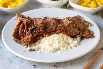 Meat doner with rice on gray background. Traditional flavors. Doner kebab made from beef and lamb....