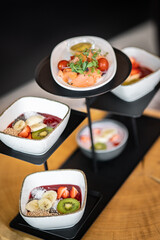 breakfast porridge with cereal, fruits and salmon