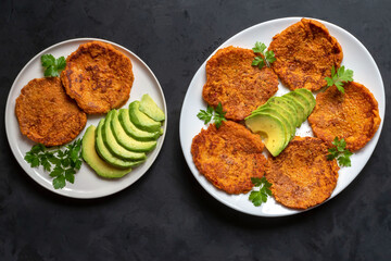 Korean kimchi vegetable fritters with grated carrots and avocados. Diet snack. Pancakes with kimchi.