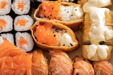 Assorted sushi nigiri and maki set. A variety of Japanese sushi with tuna, crab, salmon and rolls.