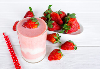 Strawberry yogurt fruit juice smoothie pink colorful fruit juice milkshake blend beverage healthy high protein the taste yummy In glass drink episode morning on white wood background.