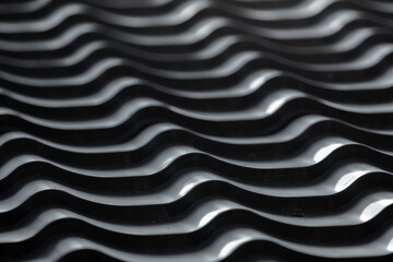 Gray metal roof tiling with wavy shape pattern, close up photo
