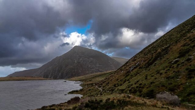 Pen yr Ole Wen mountain and Llyn Idwal lake in Snowdonia National Park Wales. the seventh highest mountain in Snowdonia and in Wales. It is the most southerly of the Carneddau range. Timelapse video