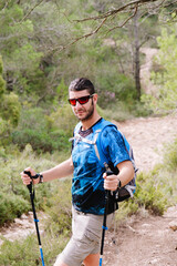 Close-up of a man equipped for trekking.