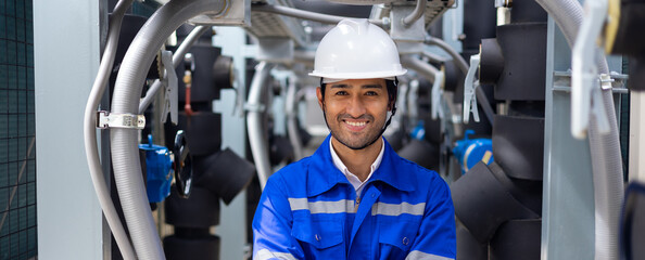 Looking at camera and smiling. Portrait handsome confident professional engineer man wearing safety...