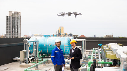 Professional inspection engineering use drone for survey building under construction site.