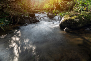 Small waterfall in rain forest rock and river ecology and beautiful nature, Environment and travel concept landscape